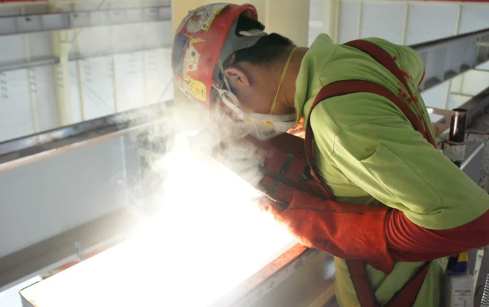 A crane specialist working on a crane upgrade